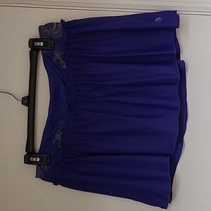 Purple skirt with neon green shorts, skorts.